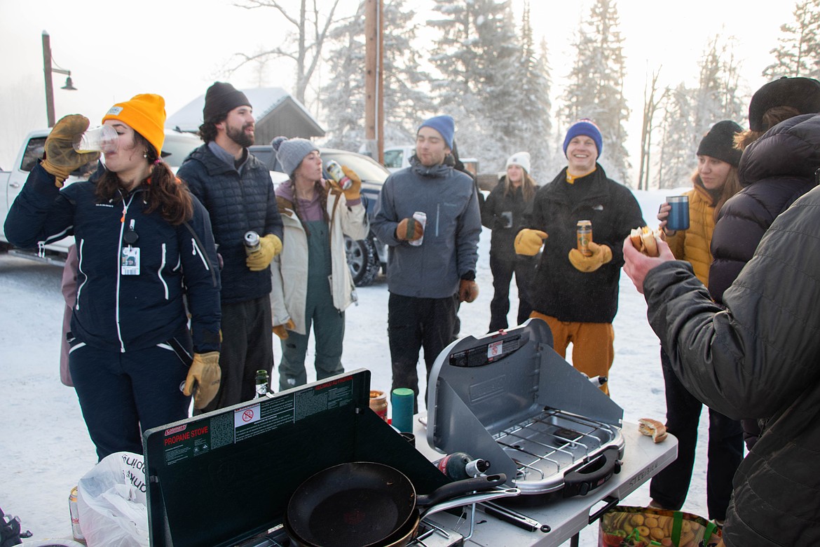 Skiers join in the parking lot before opening day at Whitefish Mountain Resort to make breakfast before the lifts open. (Kate Heston/Daily Inter Lake)