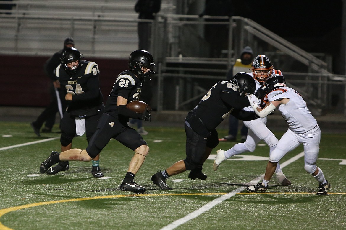 Royal senior Jackson Larsen (21) follows blockers on his way toward the end zone during last Saturday’s semifinal win over Cashmere.