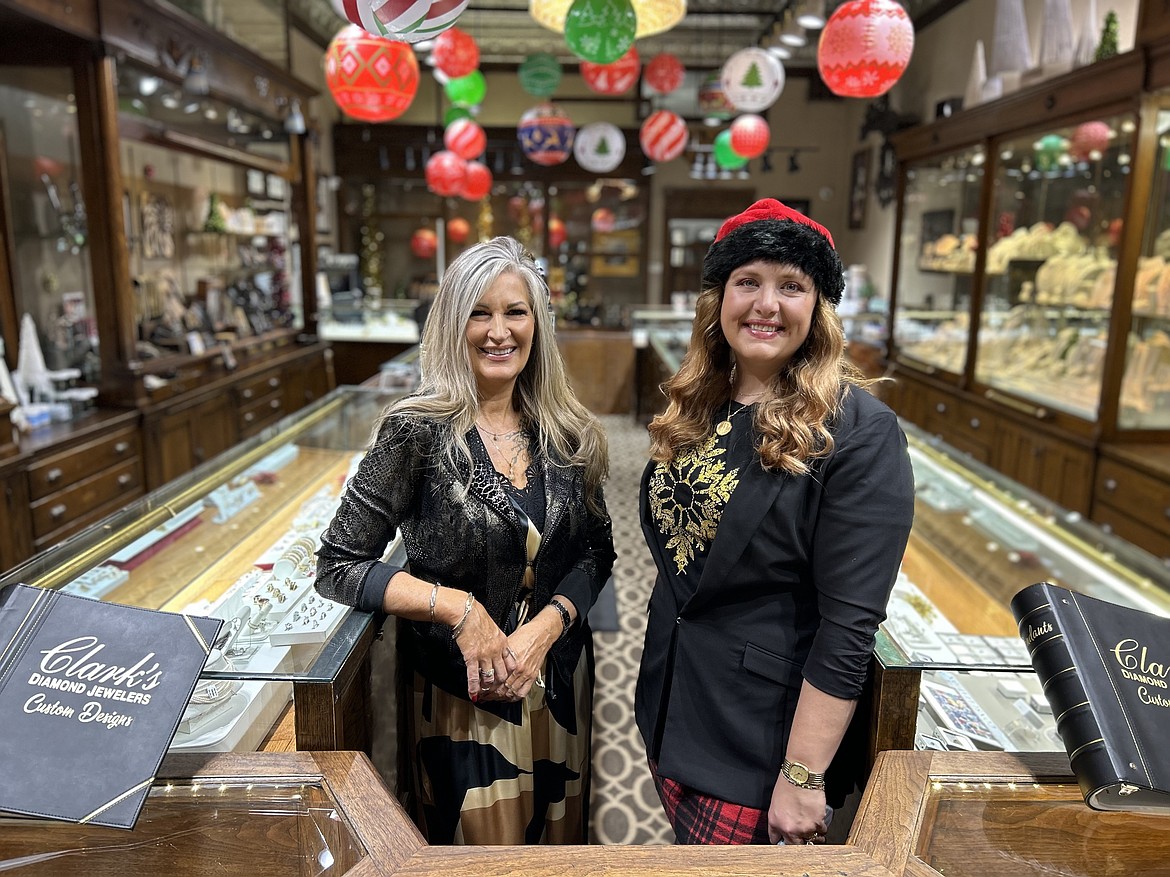 Clark's Diamond Jewelers owner Jane Clark, right, and sales manager Kim Wickham pose in the store on Thursday.