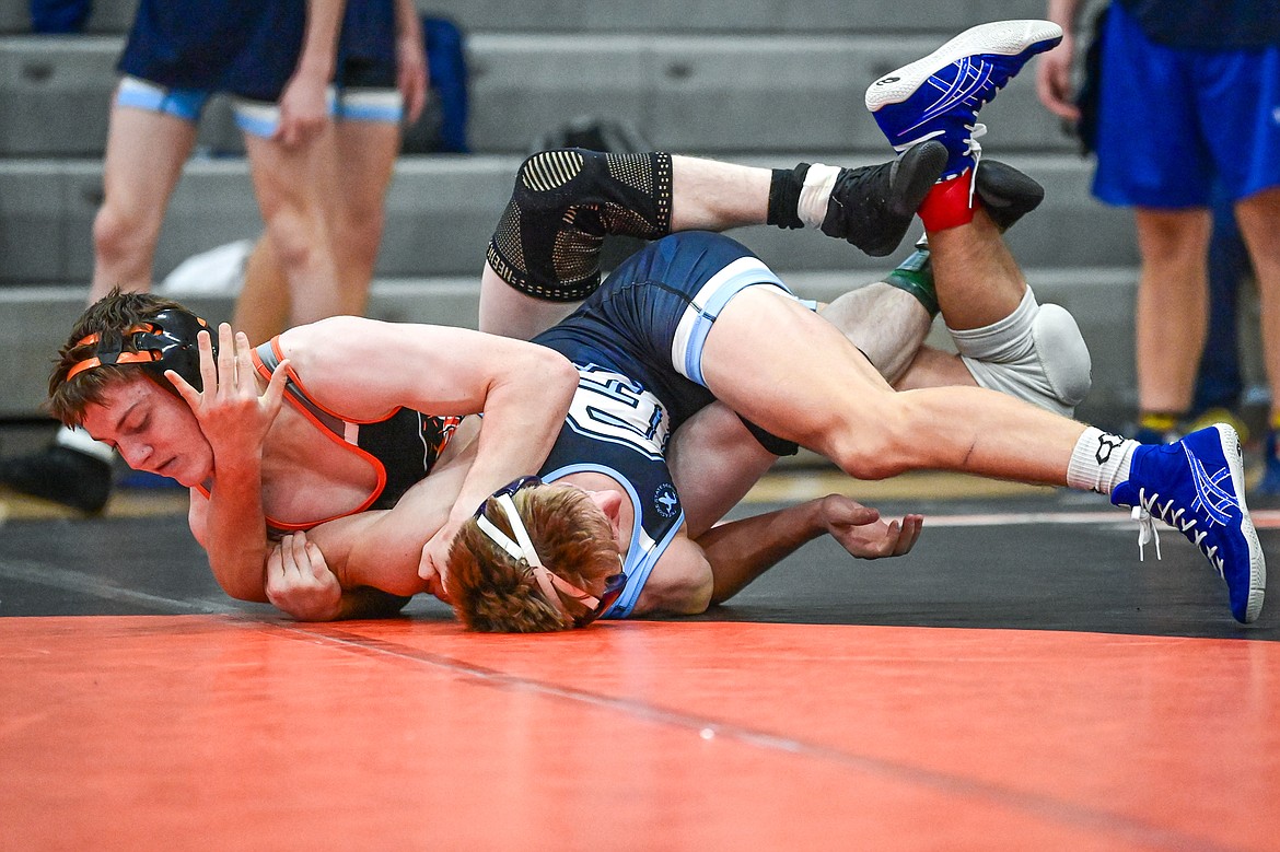 Flathead's Aiden Downing wrestles Great Falls' Bladen Madel at 144 lbs. at Flathead High School on Saturday, Dec. 7. (Casey Kreider/Daily Inter Lake)