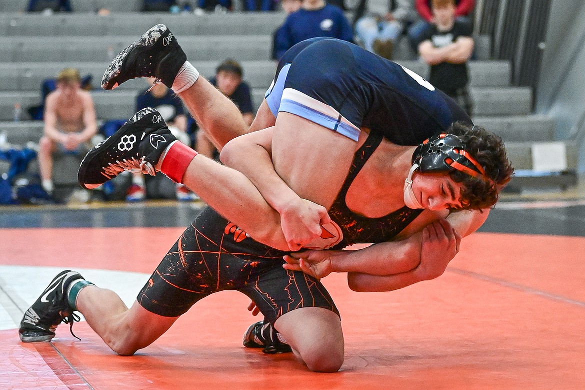 Flathead's Hunter Arriaga wrestles Great Falls' Ross Tolliver at 132 lbs. at Flathead High School on Saturday, Dec. 7. (Casey Kreider/Daily Inter Lake)