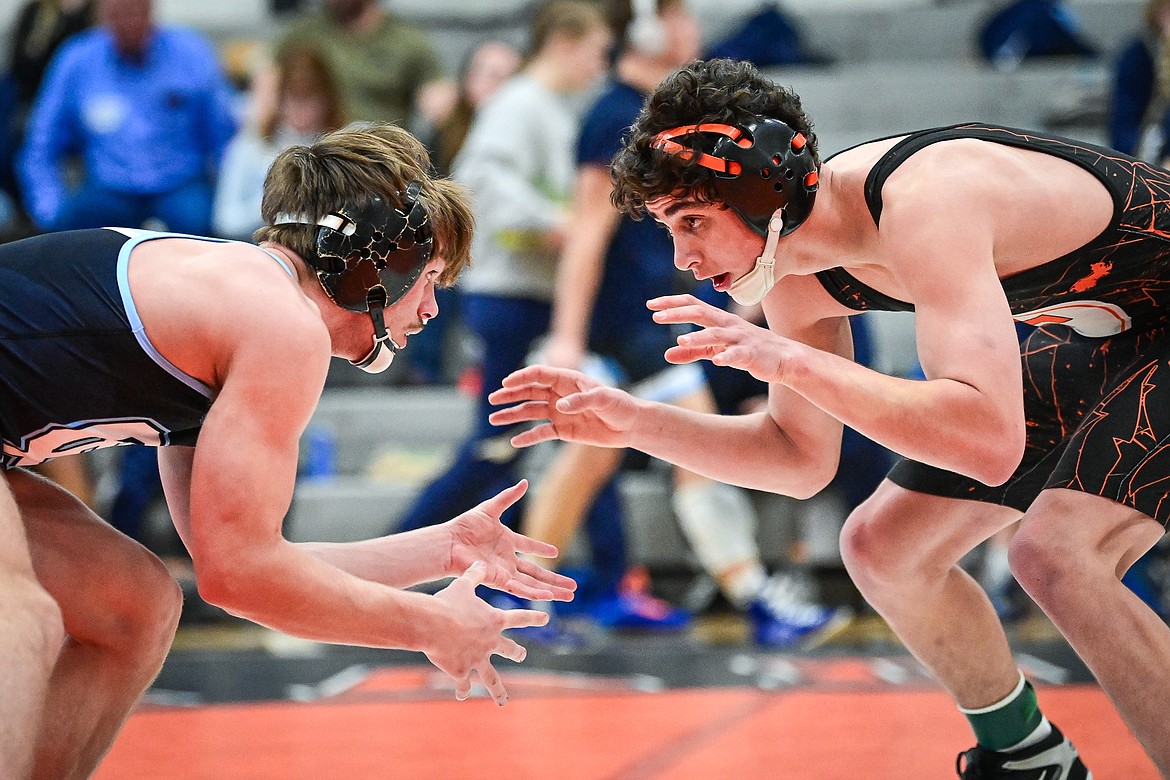 Flathead's Hunter Arriaga wrestles Great Falls' Ross Tolliver at 132 lbs. at Flathead High School on Saturday, Dec. 7. (Casey Kreider/Daily Inter Lake)