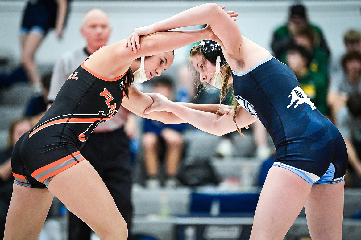 Flathead's Danica Hennel locks up with Great Falls' Andrea Kennedy at 110 lbs. at Flathead High School on Saturday, Dec. 7. (Casey Kreider/Daily Inter Lake)