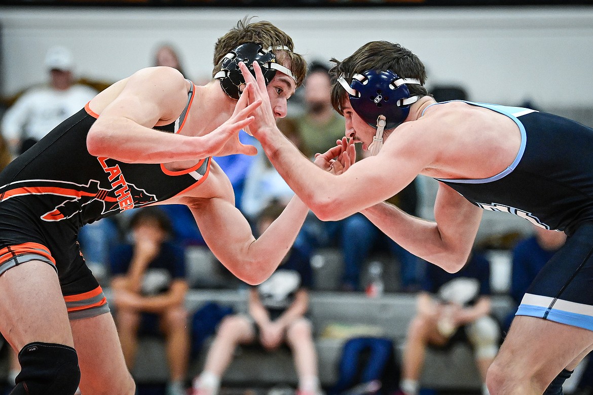 Flathead's Daniel Evert locks up with Great Falls' Gage Clothier at 138 lbs. at Flathead High School on Saturday, Dec. 7. (Casey Kreider/Daily Inter Lake)