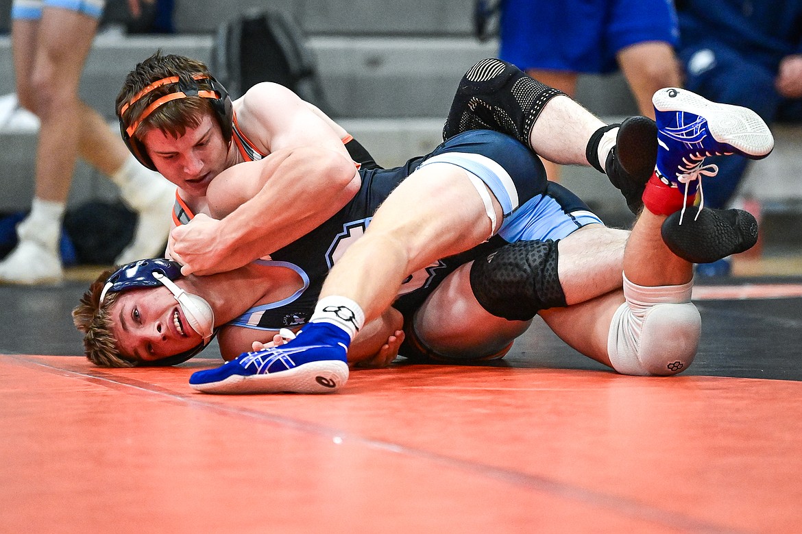 Flathead's Aiden Downing wrestles Great Falls' Bladen Madel at 144 lbs. at Flathead High School on Saturday, Dec. 7. (Casey Kreider/Daily Inter Lake)