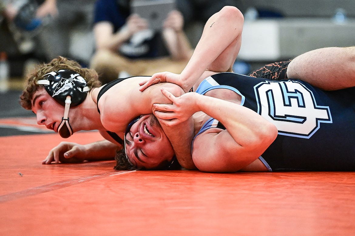 Flathead's Lane Chivers wrestles Great Falls' Jose Lara at 165 lbs. at Flathead High School on Saturday, Dec. 7. (Casey Kreider/Daily Inter Lake)