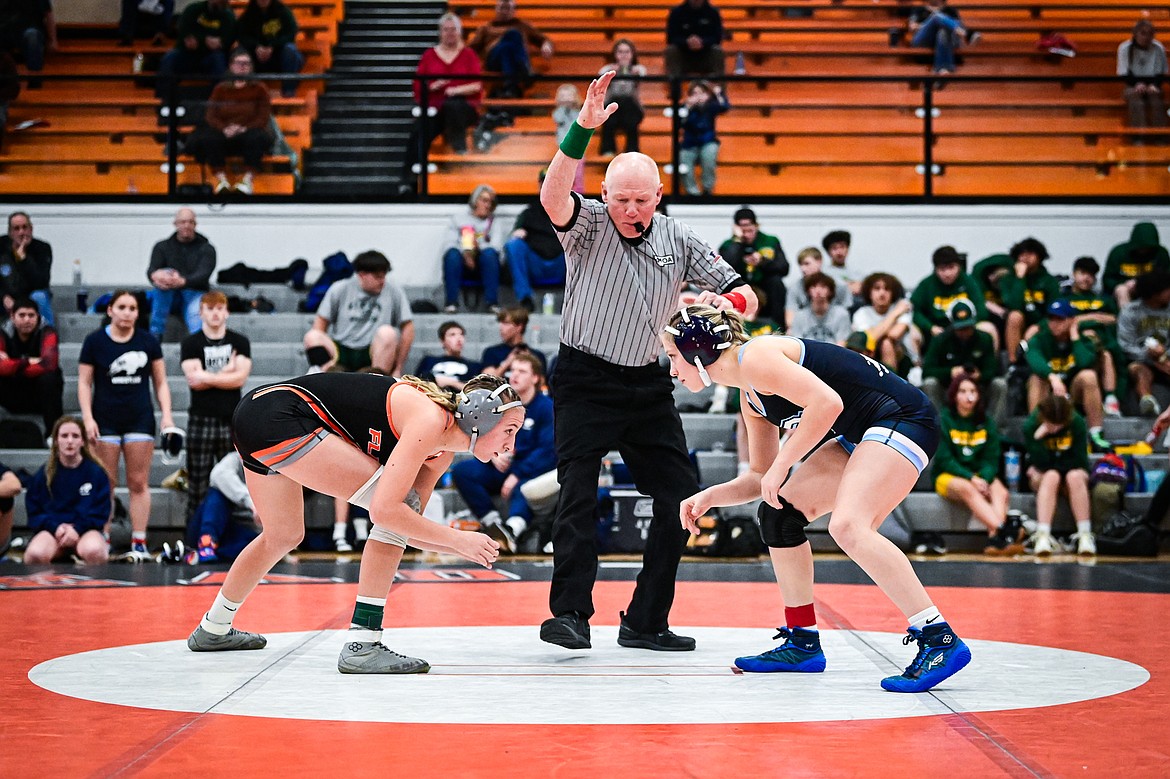 Flathead's Julia Kay squares off with Great Falls' Kyndra Ducharme at 130 lbs. at Flathead High School on Saturday, Dec. 7. (Casey Kreider/Daily Inter Lake)