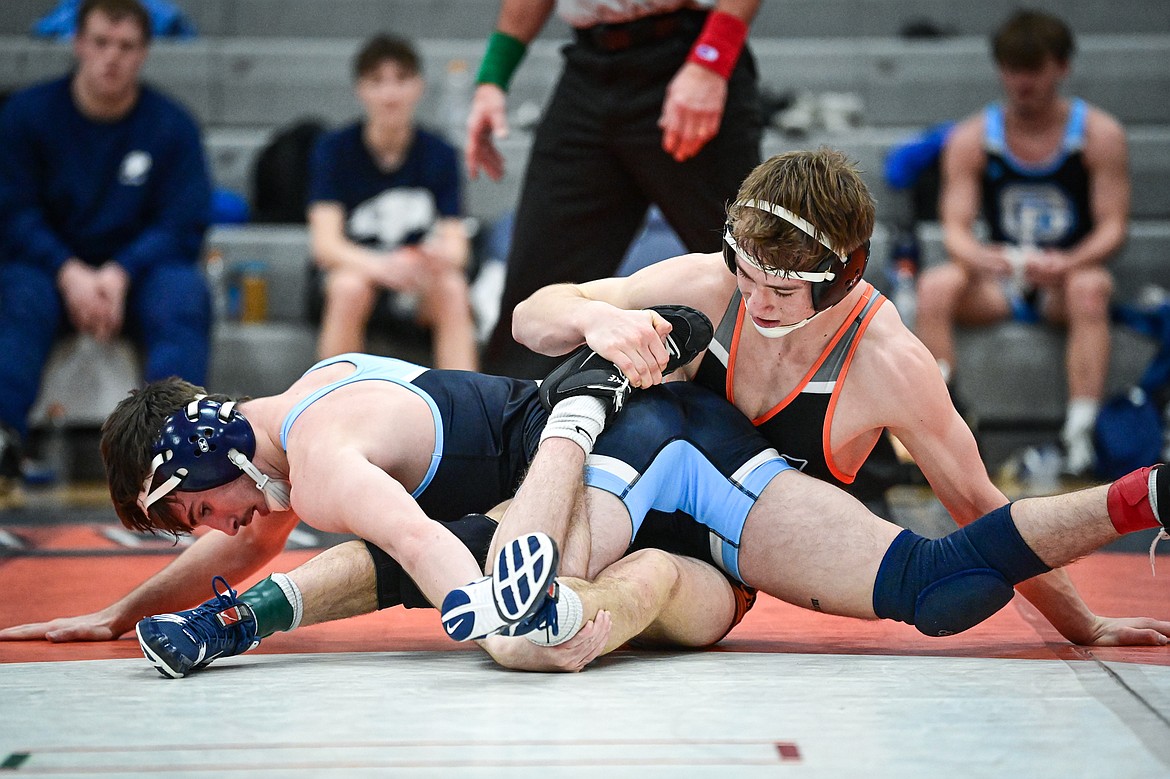 Flathead's Daniel Evert wrestles Great Falls' Gage Clothier at 138 lbs. at Flathead High School on Saturday, Dec. 7. (Casey Kreider/Daily Inter Lake)