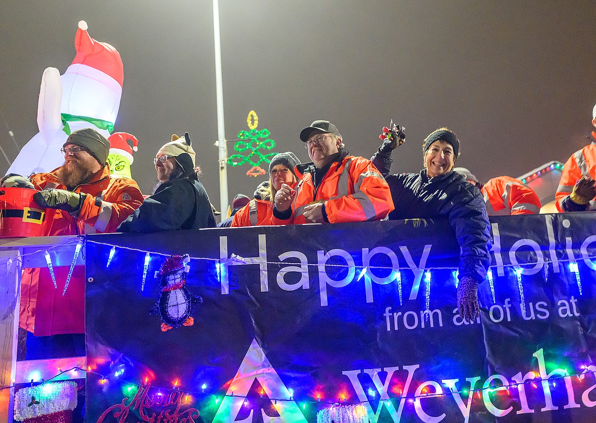 Rebecca Hamilton, far right, greets the crowd from the Weyerhaeuser float.