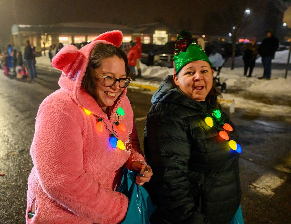 Ladies hand out candy in the parade.