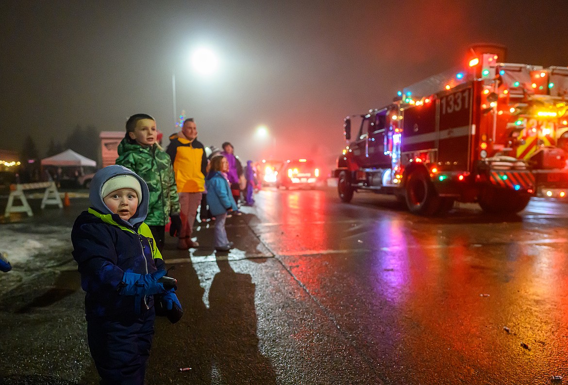 Cooper Lund, 2, watches the parade.