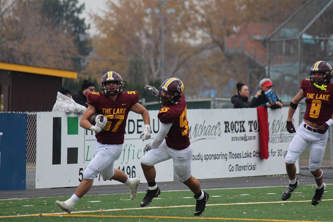 Moses Lake players celebrate after a fumble return during the 2024 season. Coaches working for $1 and volunteers have helped keep Moses Lake School District extracurricular activities afloat for the 2024-25 school year.