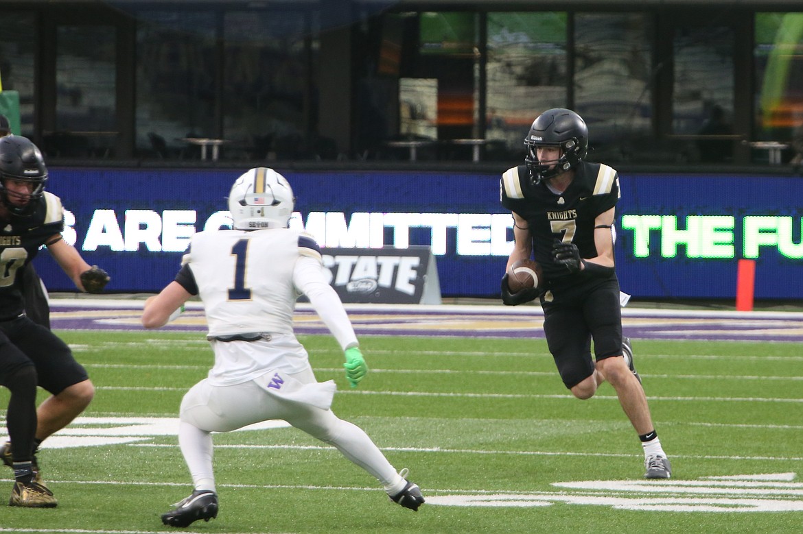 Royal sophomore Grant Wardenaar (7) returns an intercepted pass during the first quarter against Seton Catholic on Friday. Wardenaar intercepted two passes in the win, and the Knights had four interceptions during the course of the game.