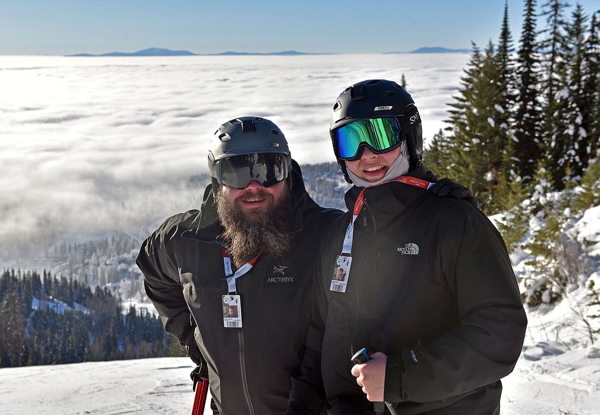 Aaron and Jack Ullrich enjoy a Big Ravine run on opening day. (Julie Engler/Whitefish Pilot)