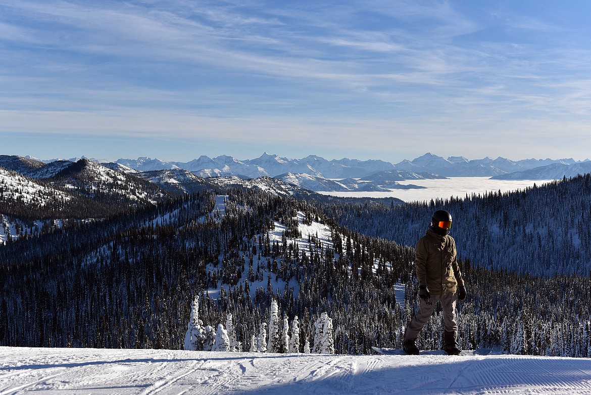 A snowboarder pauses atop the anthill during opening day's inversion. (Julie Engler/Whitefish Pilot)