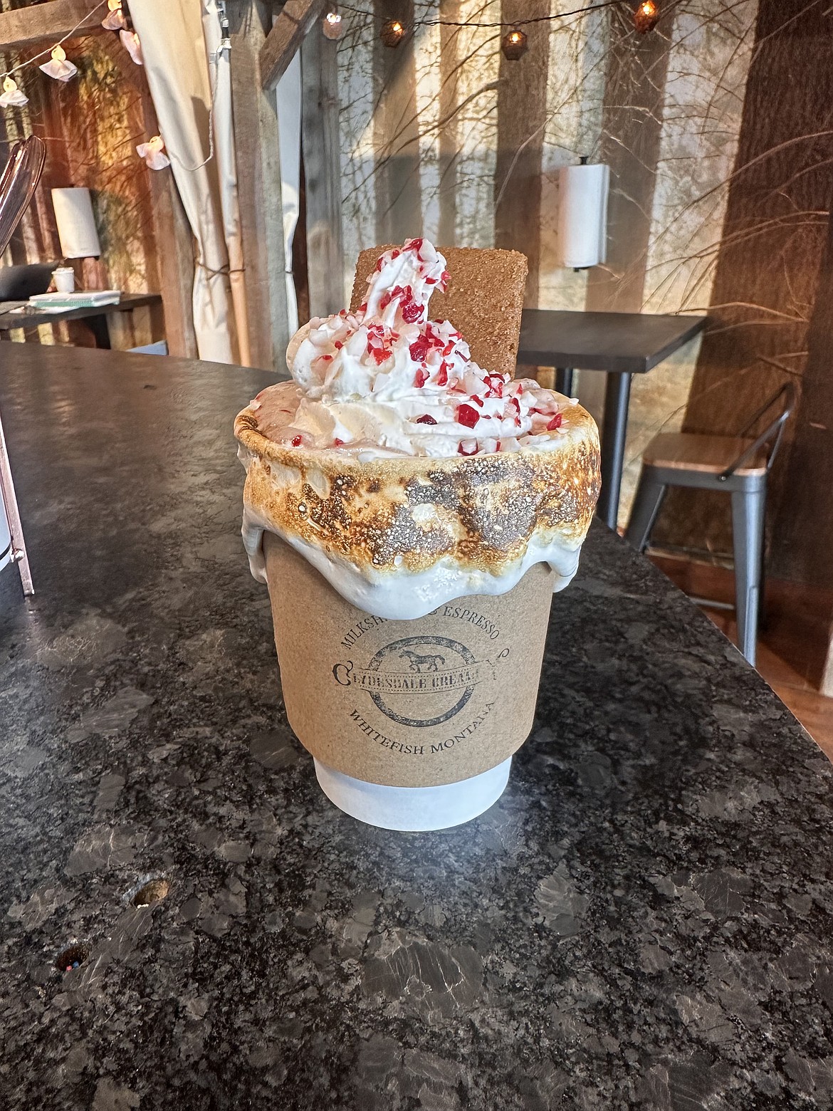 Clydesdale Creamery's Specialty Hot Cocoa, shown in a to-go cup with fire-roasted marshmallow cream. (Photo provided)