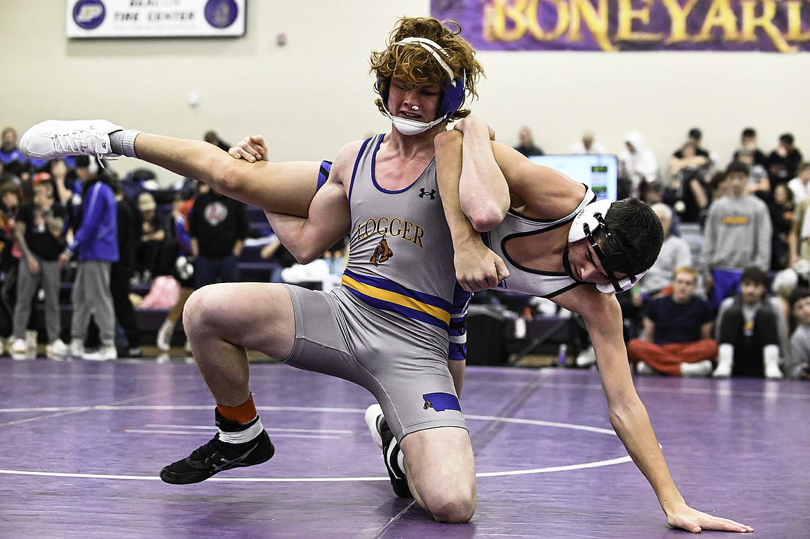 Libby's Gabe Kosters works his opponent over his back at the Owen Invitational wrestling tournament Saturday, Dec. 7, 2024, in Polson. (Seth Anderson Photography)