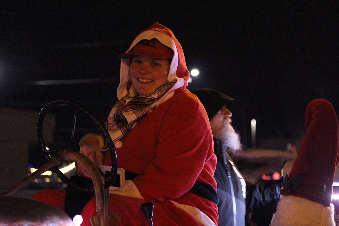 An Ag Parade participant dressed in a warm Santa helper costume but skipped Santa’s beard.