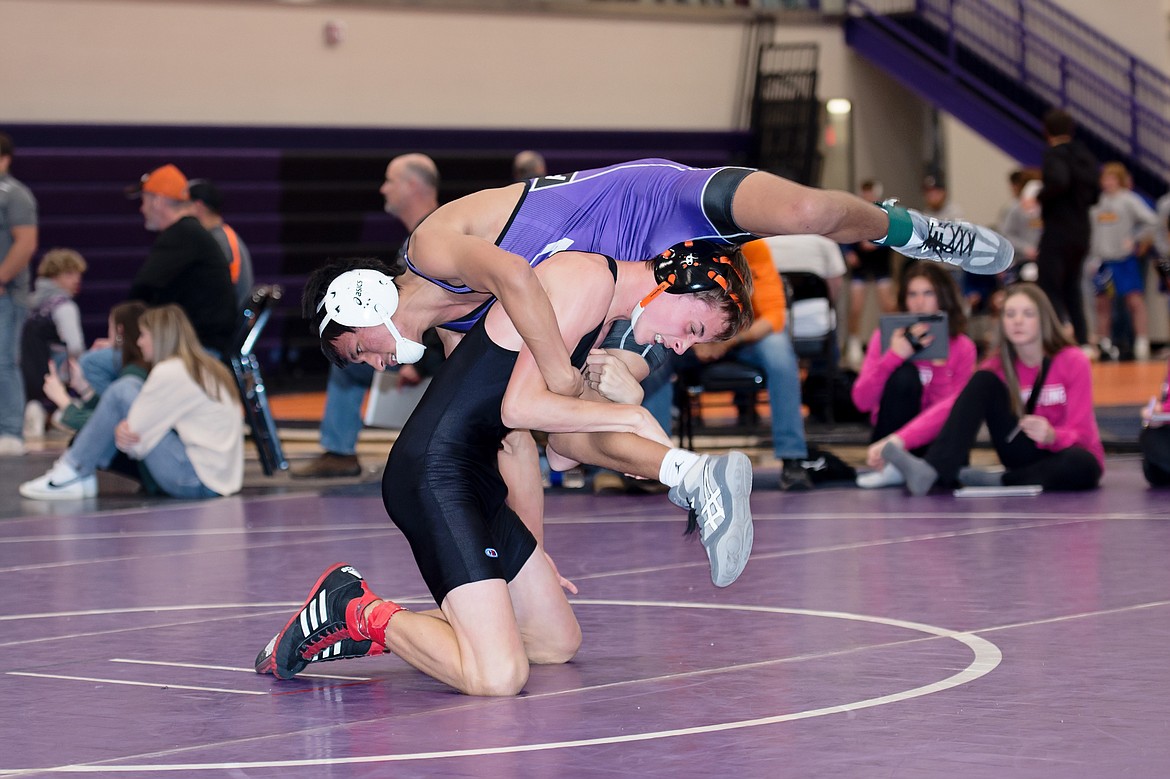 Plains 126-pounder John Owen Jermyn works to get a Polson wrestler off his back during the Owen Invitational meet this Friday in Polson.  (Photo by Teresa Waterbury)