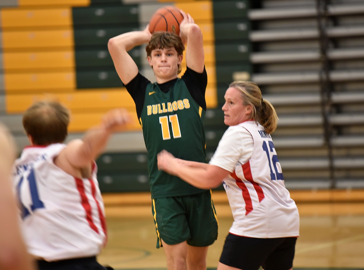 Whitefish High School basketball players played against a squad of police officers and high school teachers for the Mega Bowl fundraiser on Friday. (Kelsey Evans/Whitefish Pilot)