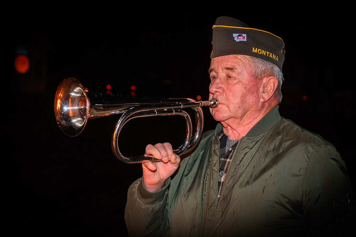 Veteran Randy Evans plays "Taps" during the VFW flag retirement ceremony. (Tracy Scott/Valley Press)