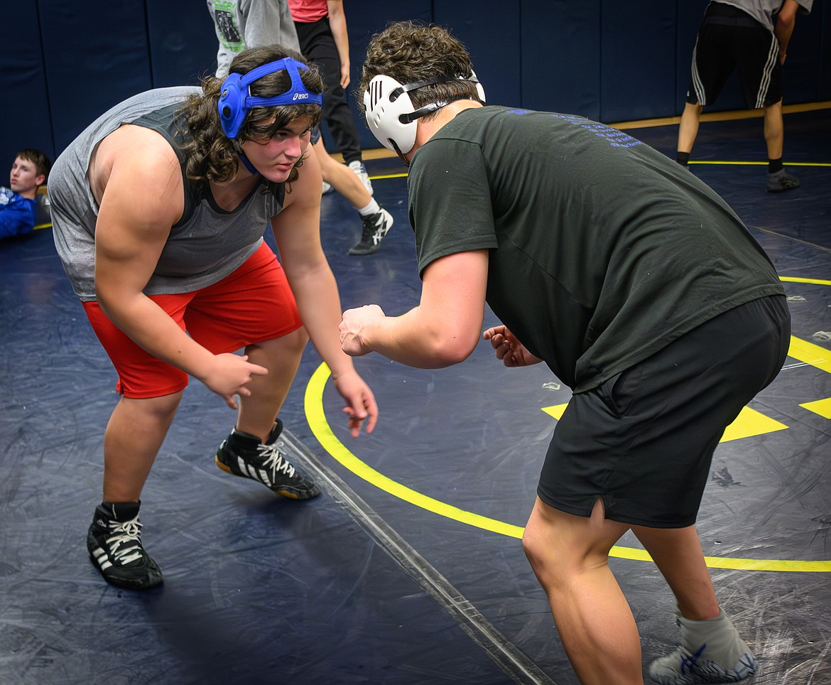 Noa Stephans and Carson Kennedy square off during preseason practice this past week for the T Falls Blue Hawks wrestling team.  (Photo by Tracy Scott)