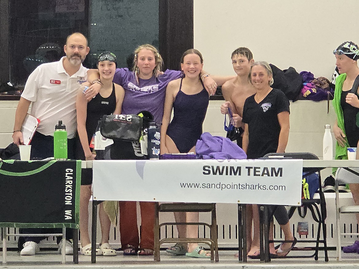 From left Sandpoint High head coach Greg Jackson, Sandpoint Sharks head coach Emily Renzini, Alivia Storms, Joshua Jackson, and Sandpoint Sharks assistant coach Alin Moss are all smiles at SWAT Winter Invite, which was held this past Friday through Sunday at the Whitworth University Aquatics Center.