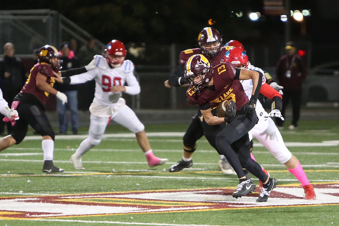 Moses Lake junior Grant Smith (13) turns up field after recording a catch against Eastmont. The Mavericks won the Columbia Basin Big 9 for the first time since 2021 this fall.