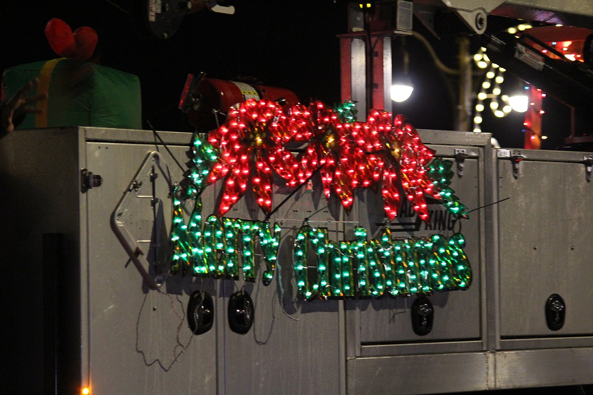 A sign on one of the Othello Christmas parade entries provides a cheery holiday greeting.