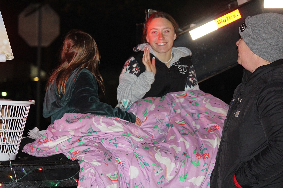 Riders on floats in the Othello Christmas parade bundled up against the cold but were all smiles just the same.