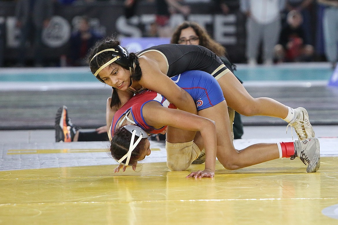 Royal junior Sharon Arroyo, top, wrestles at last year’s state finals in Tacoma. Arroyo won the 105-pound class at Saturday’s Ladycat Kickoff Classic at Eastmont.