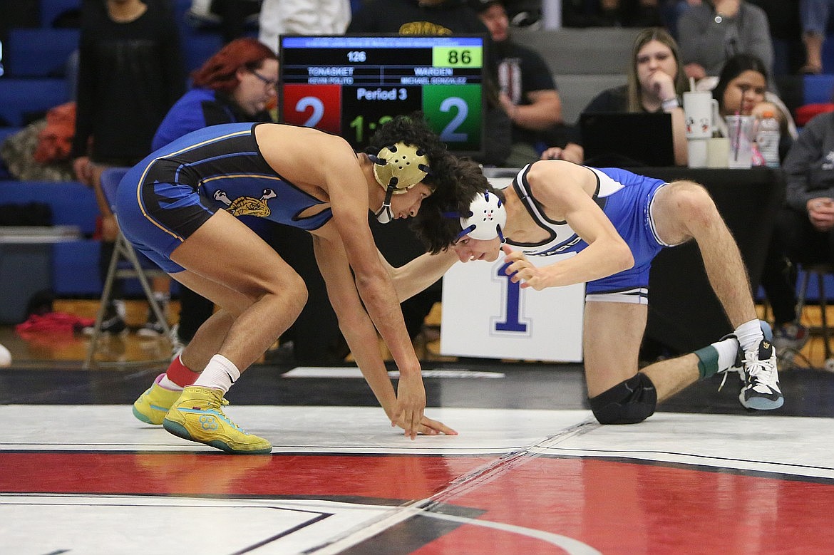 Warden senior Michael Gonzalez, right, was among eight Cougars that placed at Saturday’s Omak Invitational.