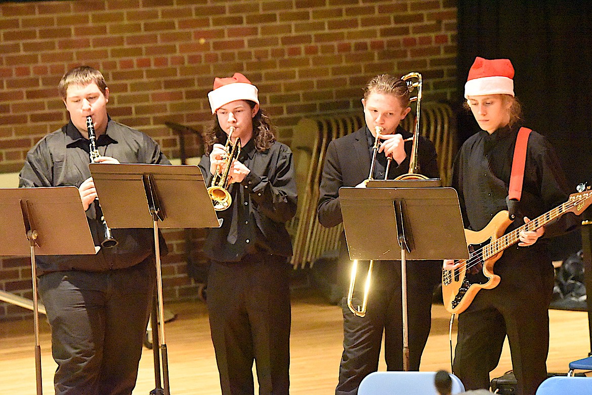 Libby High School band members Reed Viergutz, Riley Stoltz, Holden Cooper and Nolan Cartwright perform "O Christmas Tree" during the Dessert Concert Tuesday, Dec. 10, 2024, at the Memorial Center. (Scott Shindledecker/The Western News)
