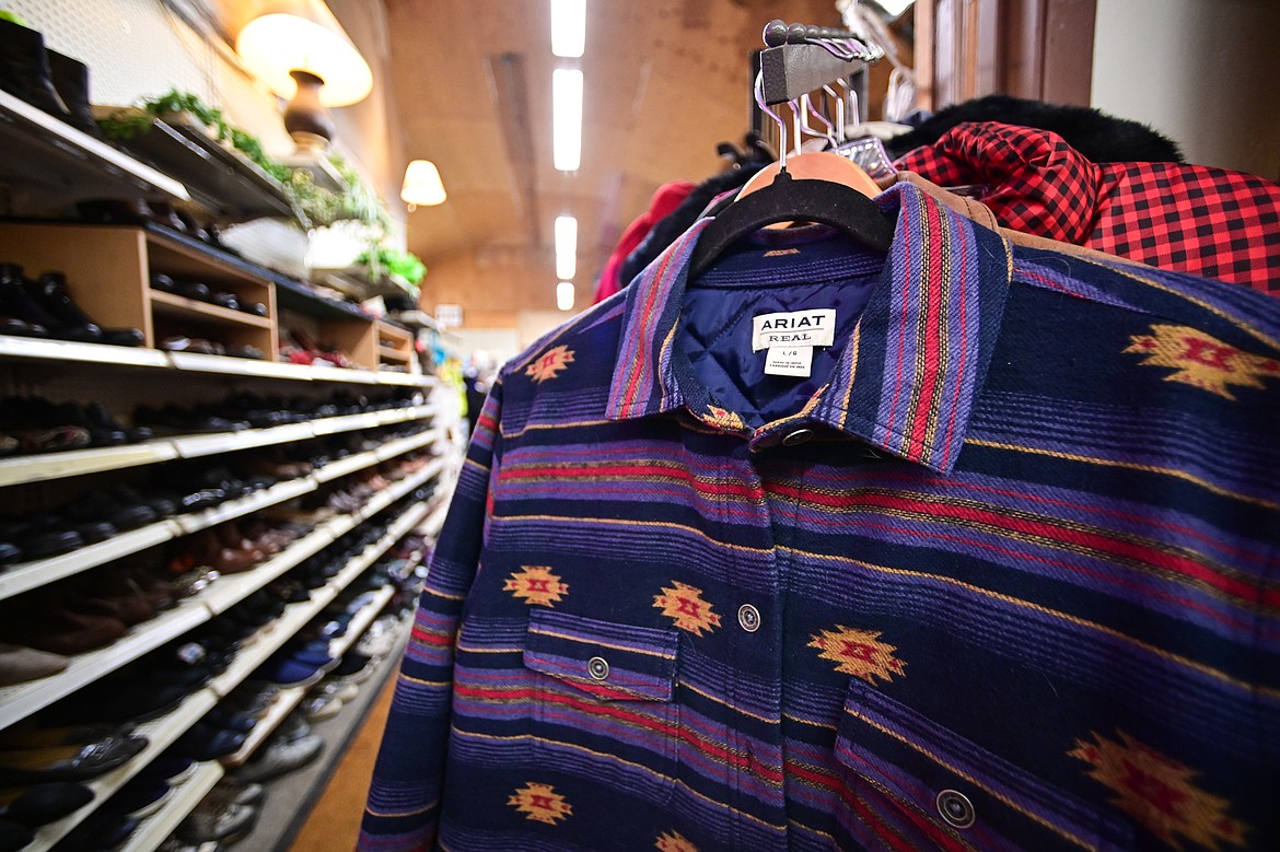 Racks of men's and women's clothing and shelves of footwear at Hope Thrift in Kalispell on Wednesday, Dec. 10. (Casey Kreider/Daily Inter Lake)