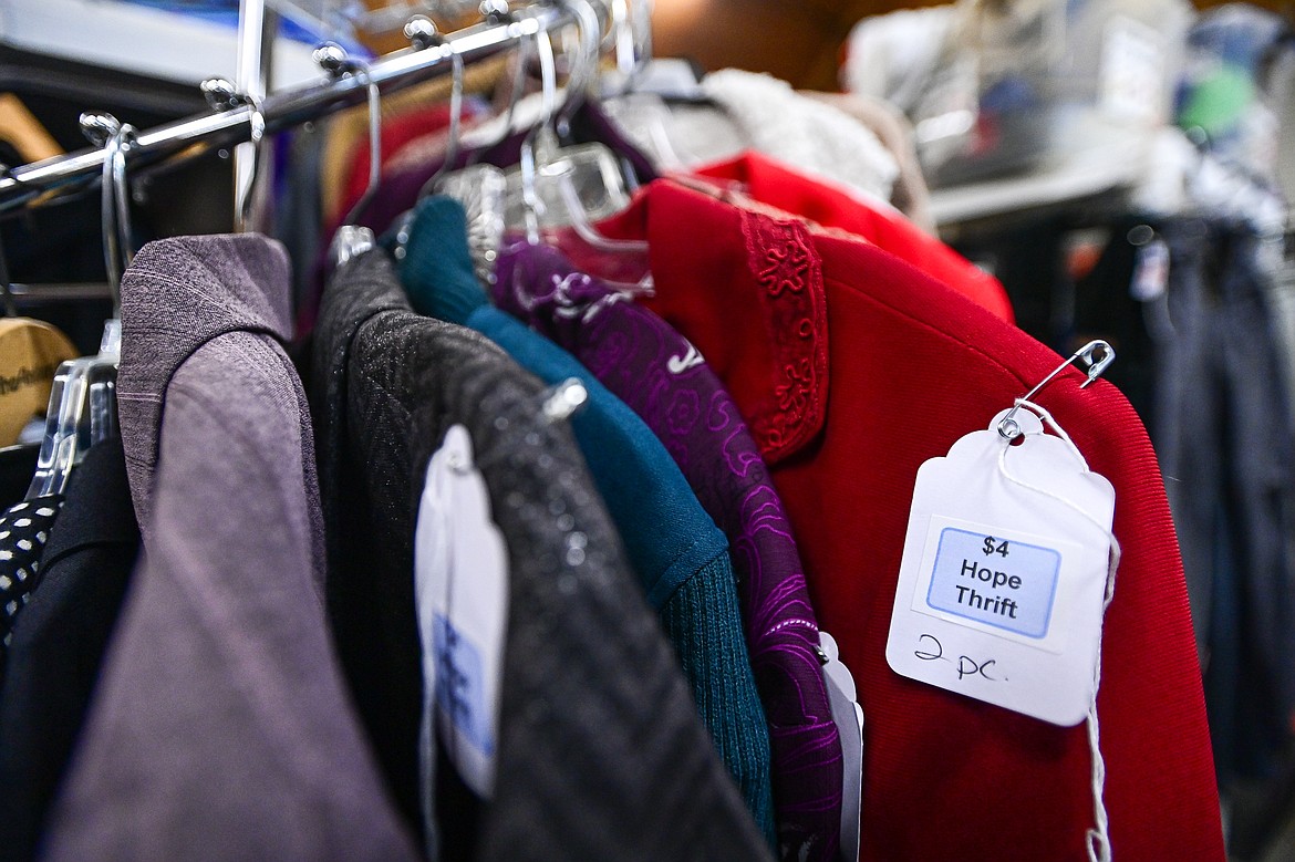 Racks of clothing for men and women at Hope Thrift in Kalispell on Wednesday, Dec. 11. (Casey Kreider/Daily Inter Lake)