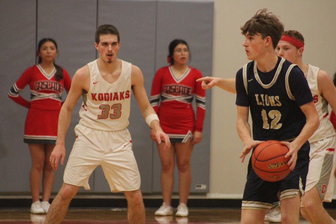 MLCA/CCS sophomore Treyson Kast (12) looks for a teammate to pass the ball to during Monday’s game against Cascade (Leavenworth).