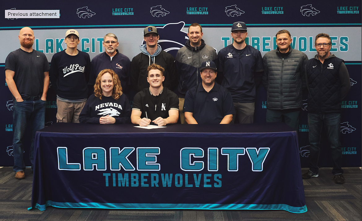 Courtesy photo
Lake City High senior Owen Mangini recently signed a letter of intent to play baseball at the University of Nevada. Seated from left are Heather Mangini (mother), Owen Mangini and Mike Mangini (Father); and standing from left, Kenny Eilmes (fielding coach), Lindsay Herbert (personal trainer), Darren Taylor (Coeur d'Alene Lumbermen American Legion coach), Kyle Johnson (hitting coach), Troy Anderson (Lake City High athletic director), Cody Garza (Lake City High assistant coach), Paul Manzardo (former Lake City High head coach) and Mike Criswell (Lake City High head coach).