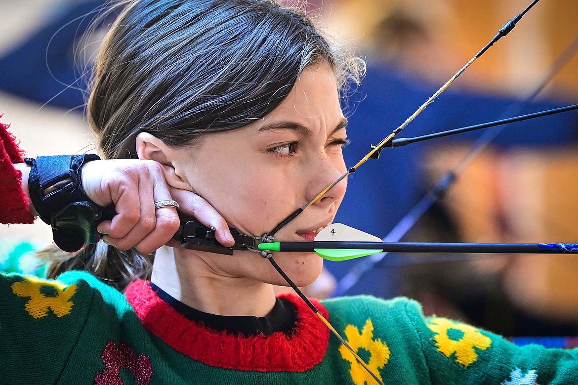 Olivia Druyvestein readies an arrow during a round of archery practice with Flathead 4-H Shooting Sports on Thursday, Dec. 12. (Casey Kreider/Daily Inter Lake)