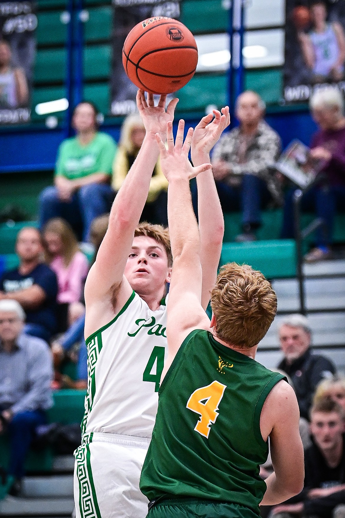 Glacier's Ethan Kastelitz (4) shoots guarded by Great Falls CMR's Jonah Van Tassell (4) in the third quarter at Glacier High School on Friday, Dec. 13. (Casey Kreider/Daily Inter Lake)