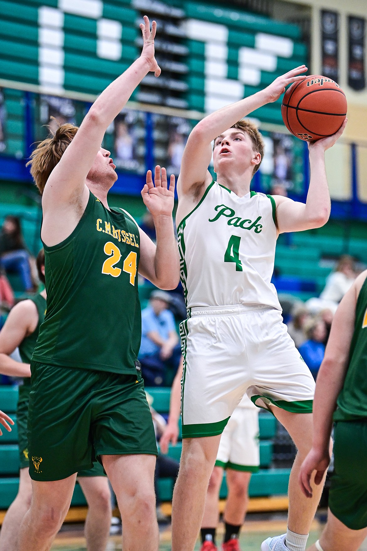 Glacier's Ethan Kastelitz (4) drives into the paint for a shot in the first quarter against Great Falls CMR at Glacier High School on Friday, Dec. 13. (Casey Kreider/Daily Inter Lake)