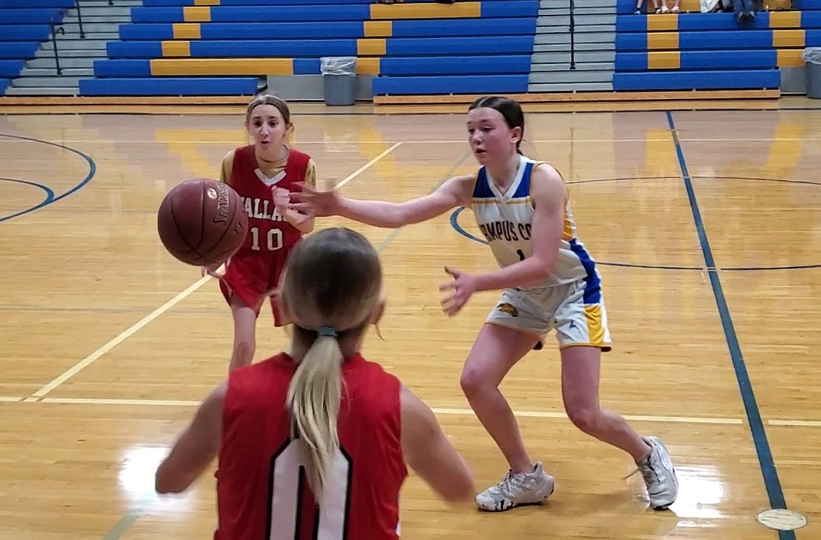 Clark Fork eighth grader Vanessa Rogier steals a Wallace inbound pass during the Lady Cats' 'A' team 34-16 season-opening win on Dec. 11