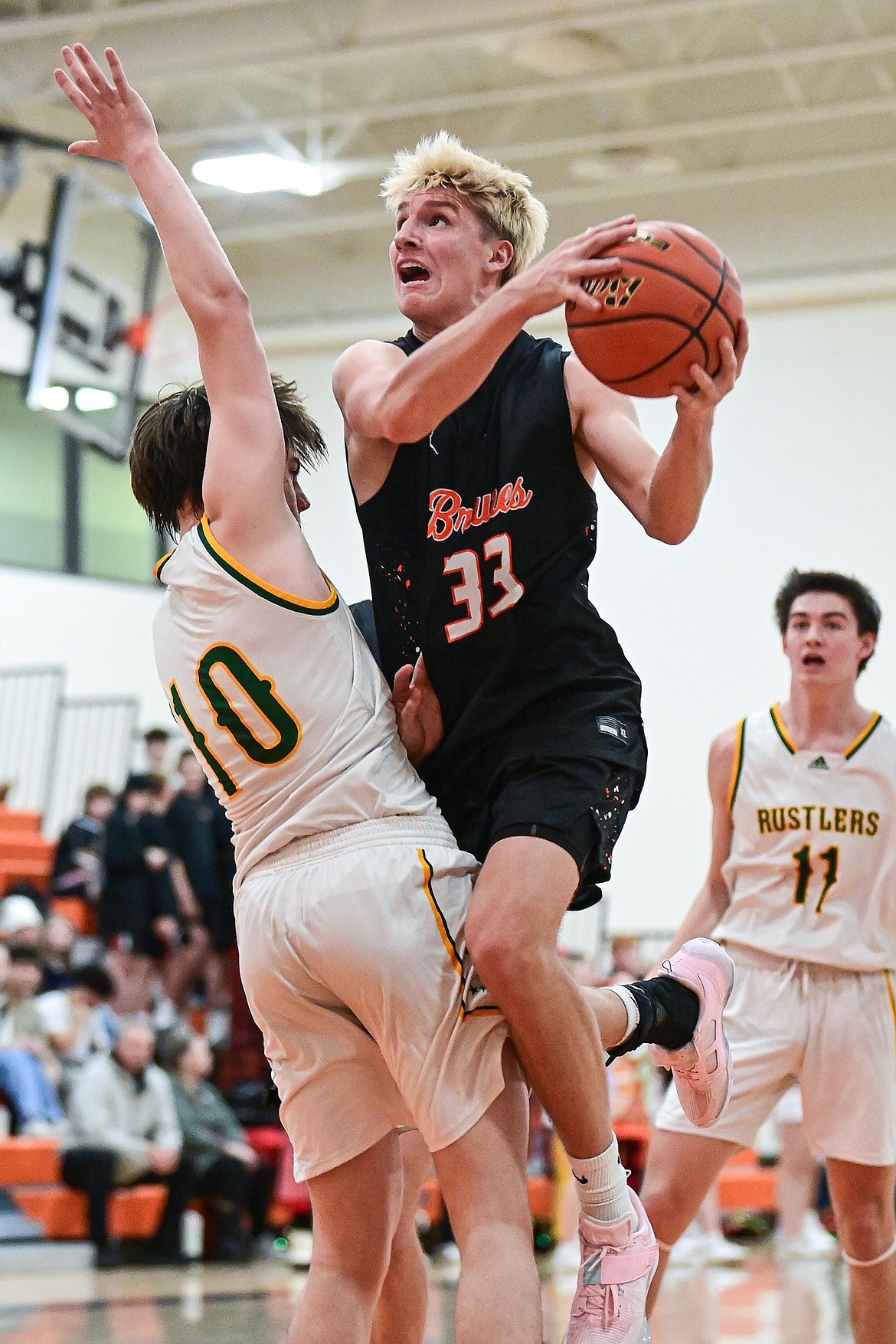 Flathead's Korbin Eaton (33) drives to the basket in the second quarter against Great Falls CMR inside Gene Boyle Gymnasium at Flathead High School on Saturday, Dec. 14. (Casey Kreider/Daily Inter Lake)