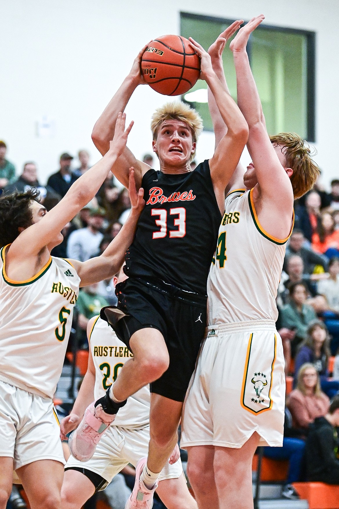 Flathead's Korbin Eaton (33) drives to the basket in the second quarter against Great Falls CMR inside Gene Boyle Gymnasium at Flathead High School on Saturday, Dec. 14. (Casey Kreider/Daily Inter Lake)