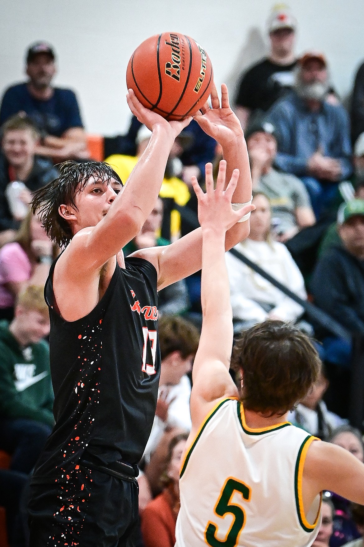 Flathead's Lyric Ersland (13) shoots from the corner in the second quarter against Great Falls CMR inside Gene Boyle Gymnasium at Flathead High School on Saturday, Dec. 14. (Casey Kreider/Daily Inter Lake)