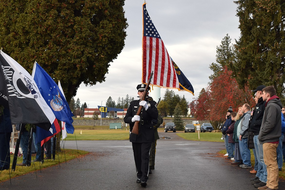 The North Idaho Color Guard presents the flags at Coeur d'Alene Memorial Gardens on Saturday.