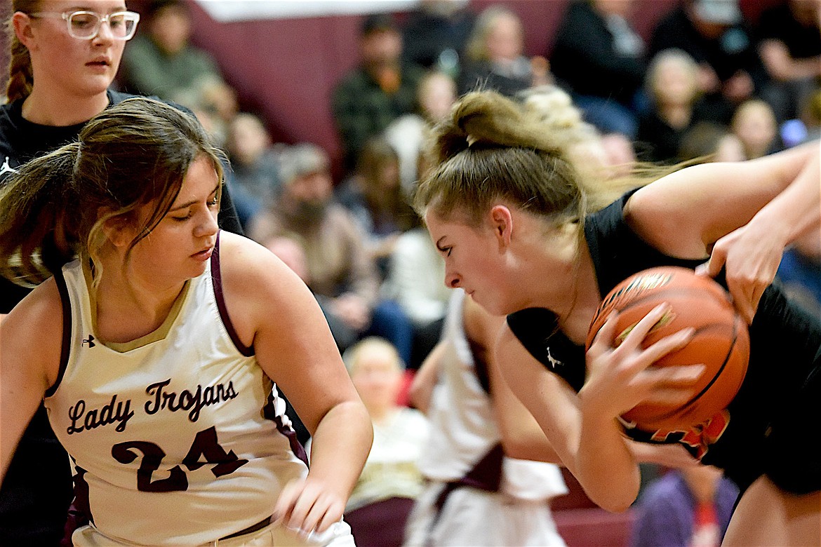 Troy's Kylie Cole defends Plains Trotters player Trystan Larsen Saturday, Dec. 14, 2024, at the Troy Activity Center. (Scott Shindledecker/The Western News)