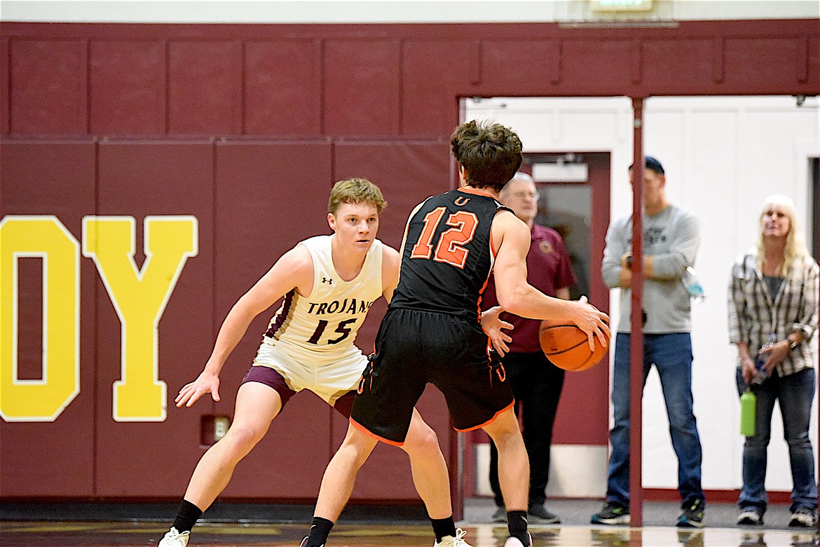 Troy's Nolan Morris plays defense against the Plains Horsemen in a 49-33 win, Saturday, Dec. 14, 2024, at the Troy Activity Center. (Scott Shindledecker/The Western News)