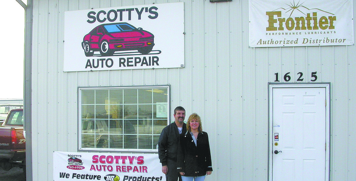 Scott, left, and Jeannette Myers in front of Scotty’s Auto Repair’s former location on Wheeler Road. That building was custom built for Scotty’s, Scott said, and the Myers family fixed cars there for 17 years.