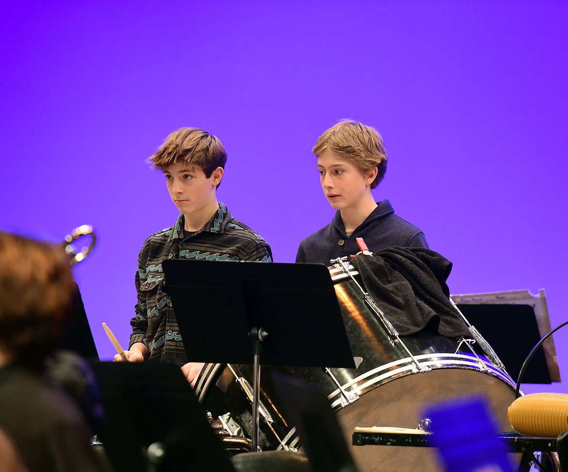 Percussionists Blake Perisho and Rylan Hoover concentrate during the concert last week. (Julie Engler/Whitefish Pilot)