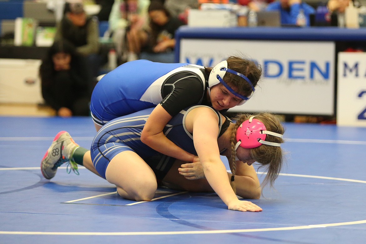 Warden junior Ashley Cruz, left, took sixth in the 135-pound class at the Warden Women’s Wrestling Invite on Saturday.